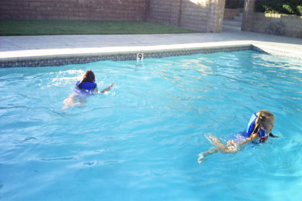 C&C Swimming with their vests on...They're Fearless!