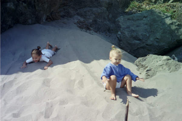 C&C Sliding down their sand slide at our private beach