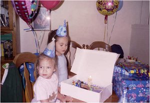 Chloe & Ris blowing out bday candle