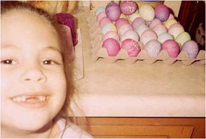 Chloe close up with colored Easter Eggs